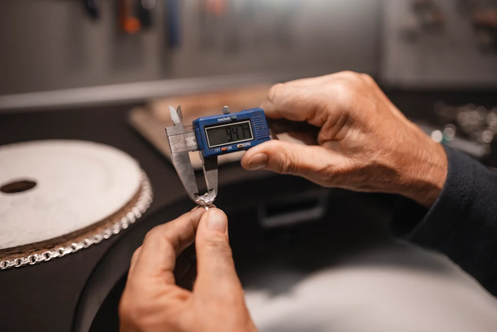 Industrial technician performing precision instrument calibration in a Saudi manufacturing facility
