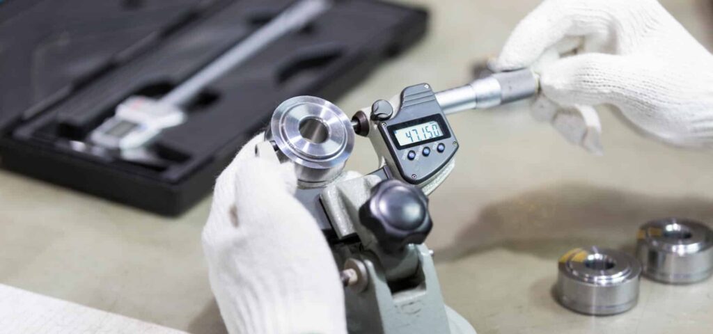 Calibration technician performing equipment calibration to maintain accuracy and reliability